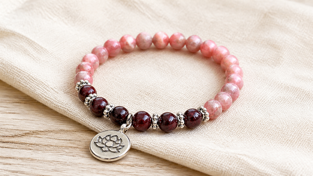 Pink rhodochrosite and burgundy garnet crystal bracelet with silver spacers and a lotus charm
