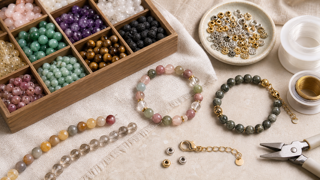 Custom crystal bracelet components including gemstone beads, gold and silver hardware, elastic cord and jewelry tools