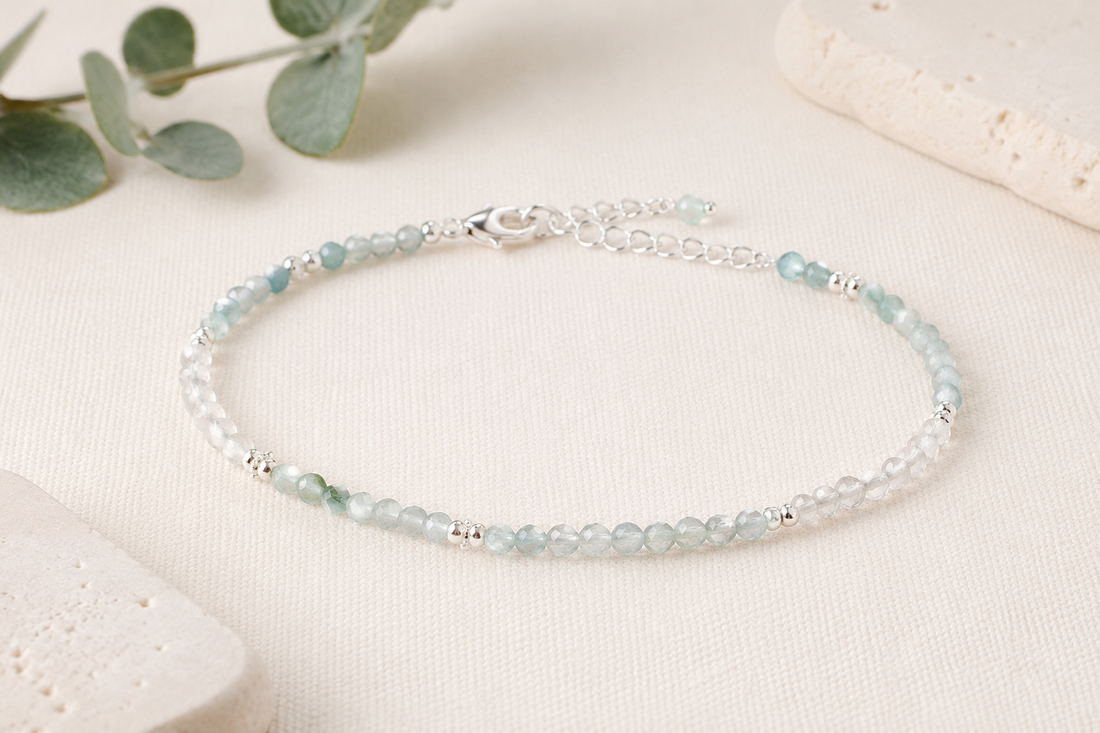 Delicate minimalist bracelet with pale aqua and translucent crystal beads on ivory linen