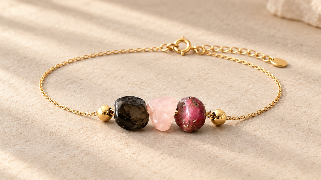 Delicate gold chain bracelet with three raw gemstone focal beads representing the Sun, Moon and Rising signs